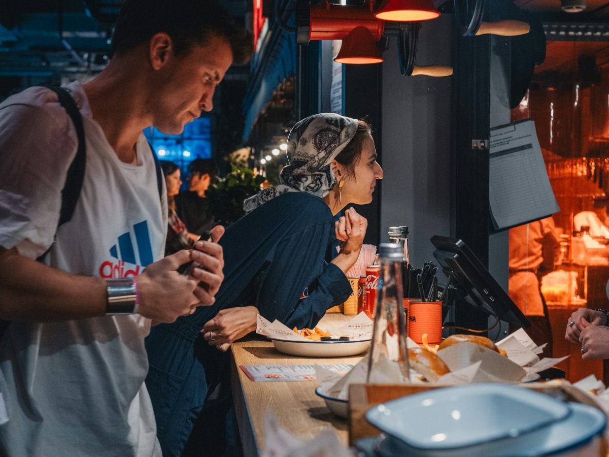 Guests ordering food at a busy bar