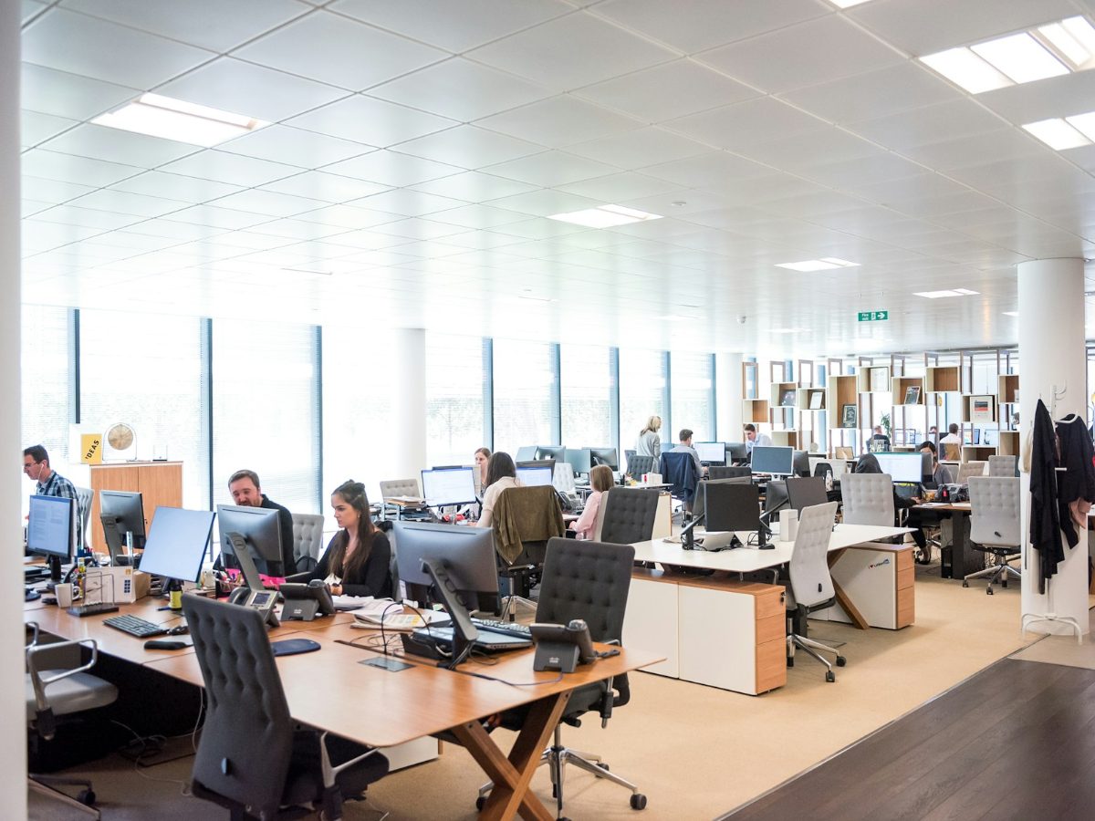Bright open-plan office with people working at desks