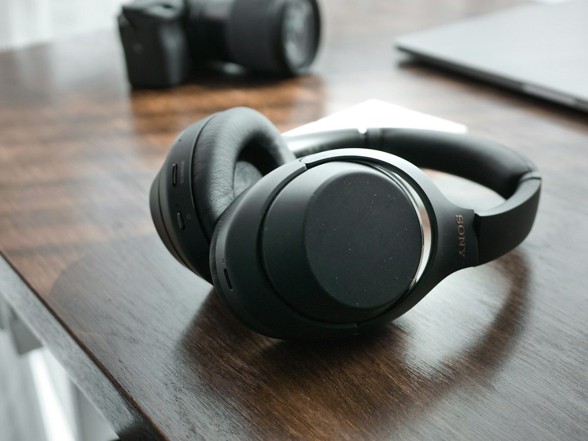 Headset resting on a wooden desk