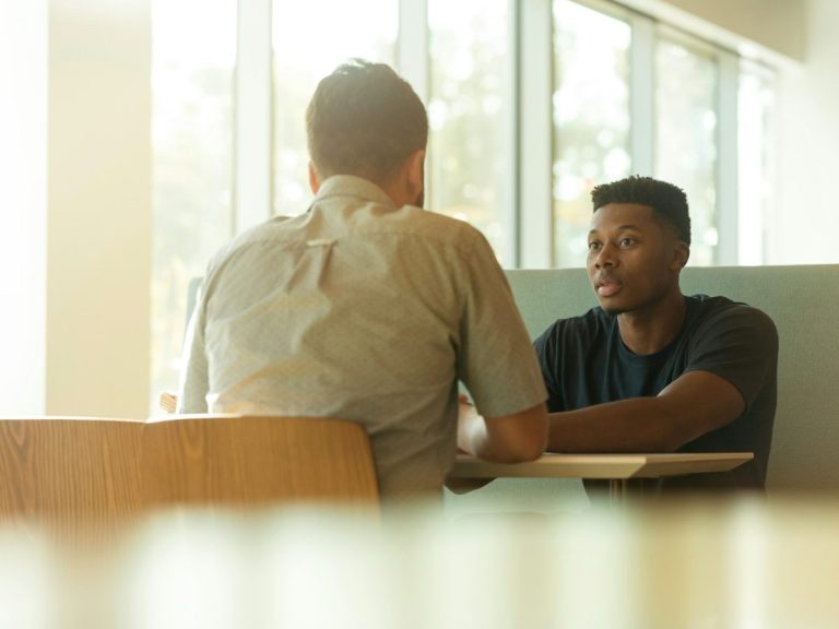 Two colleagues in a meeting at a professional services firm